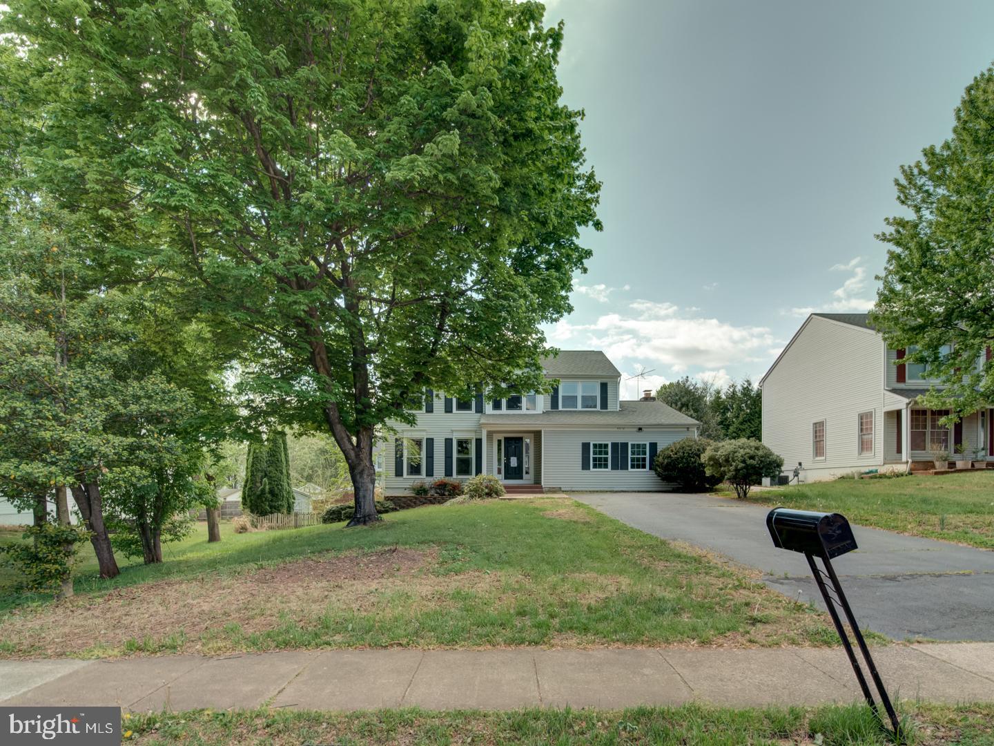 9618 Clover Hill Road Manassas, VA 20110 - Photo 3 of 61 a front view of a house with a yard