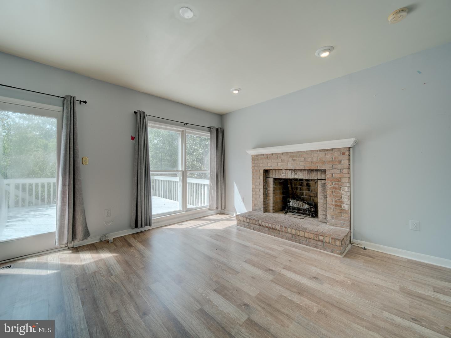9618 Clover Hill Road Manassas, VA 20110 - Photo 32 of 61 a view of an empty room with a window and fireplace