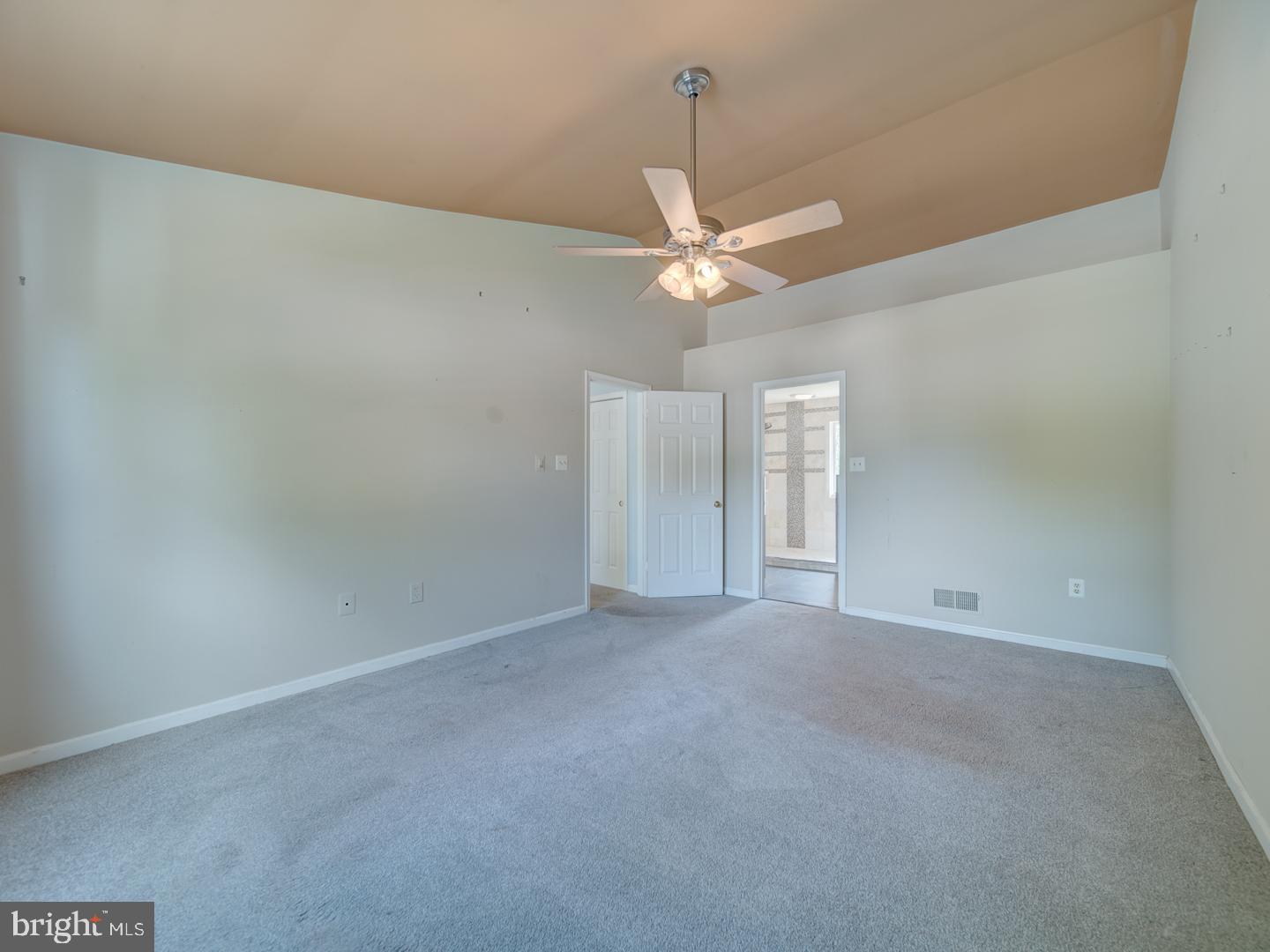 9618 Clover Hill Road Manassas, VA 20110 - Photo 38 of 61 an empty room with chandelier fan and windows