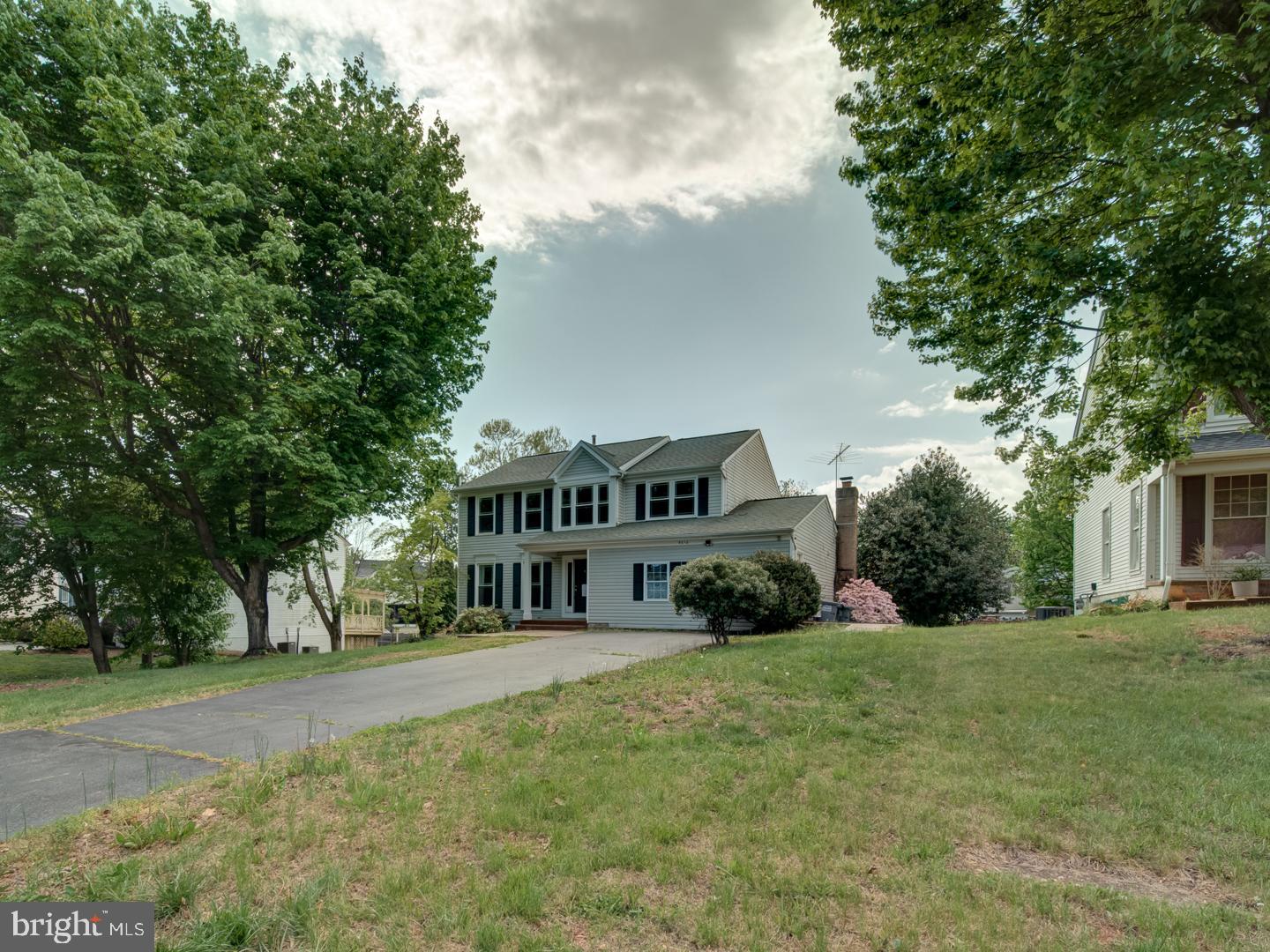9618 Clover Hill Road Manassas, VA 20110 - Photo 4 of 61 a view of house with outdoor space and trees around