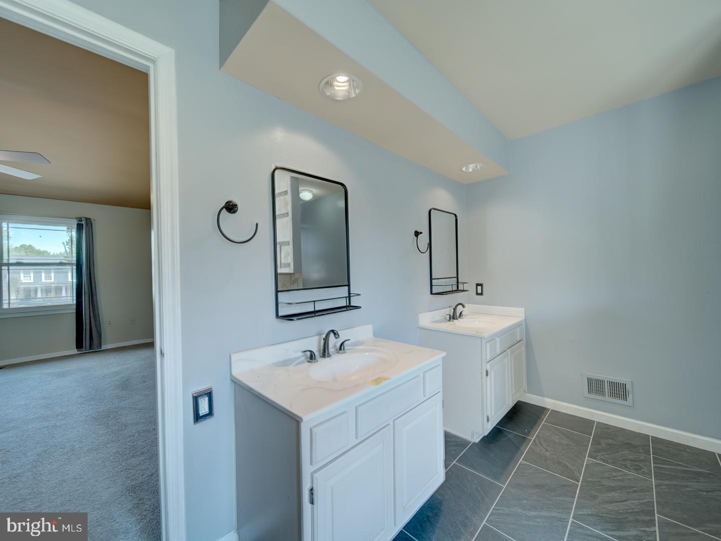 9618 Clover Hill Road Manassas, VA 20110 - Photo 41 of 61 a spacious bathroom with a double vanity sink mirror and