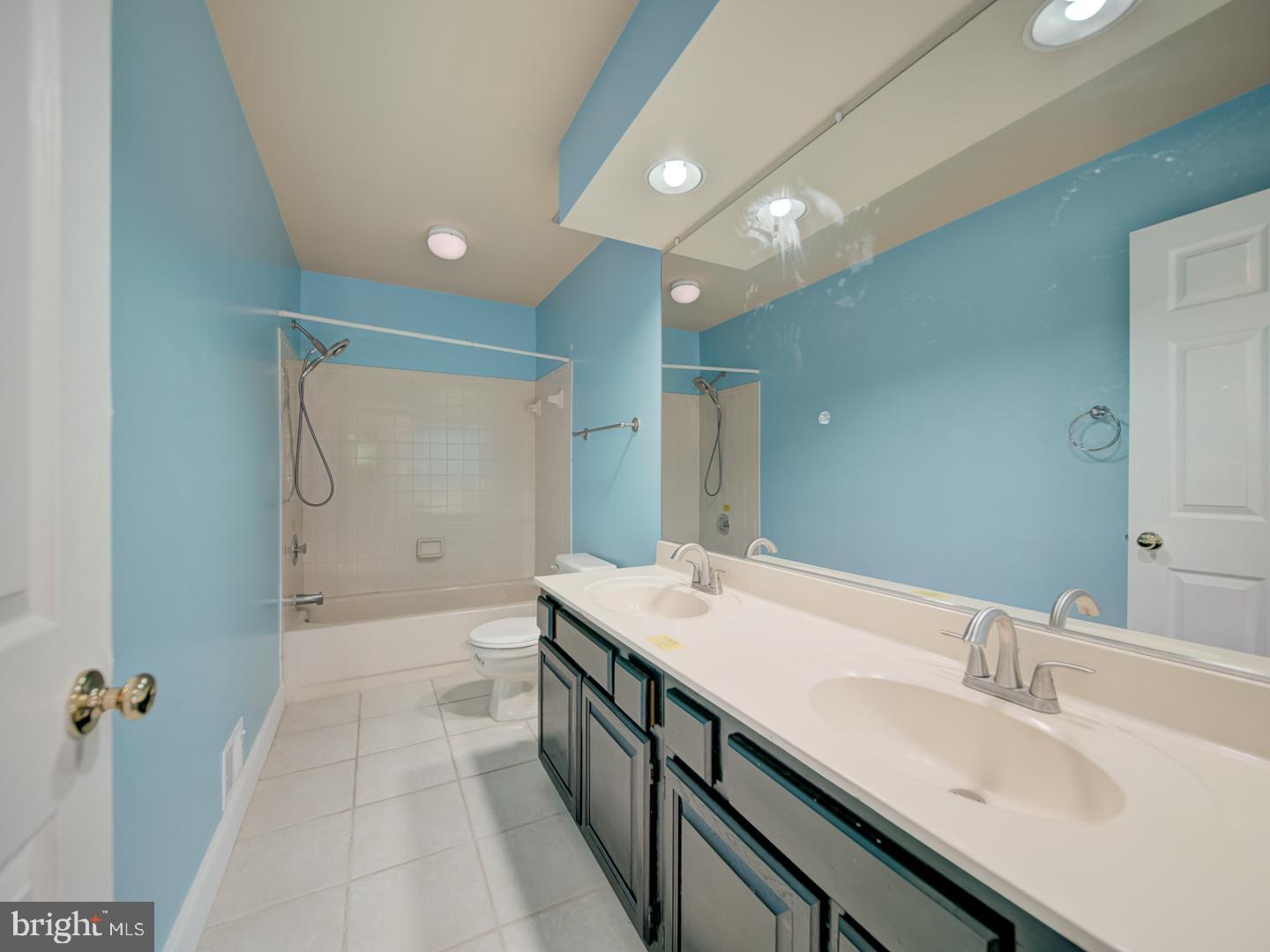 9618 Clover Hill Road Manassas, VA 20110 - Photo 50 of 61 a spacious bathroom with a double vanity sink a mirror and a bathtub