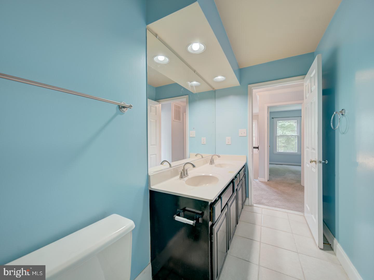 9618 Clover Hill Road Manassas, VA 20110 - Photo 51 of 61 a bathroom with a sink a toilet and shower