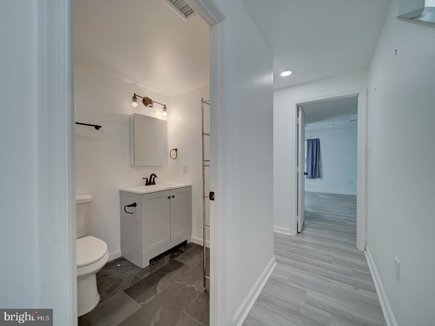 9618 Clover Hill Road Manassas, VA 20110 - Photo 52 of 61 a bathroom with a sink a toilet and shower