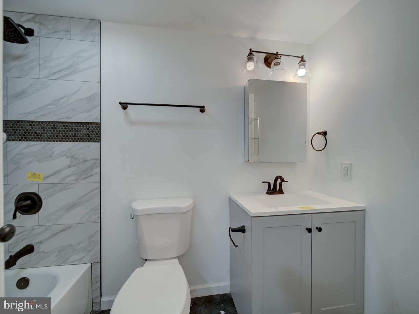 9618 Clover Hill Road Manassas, VA 20110 - Photo 53 of 61 a bathroom with a sink toilet and shower
