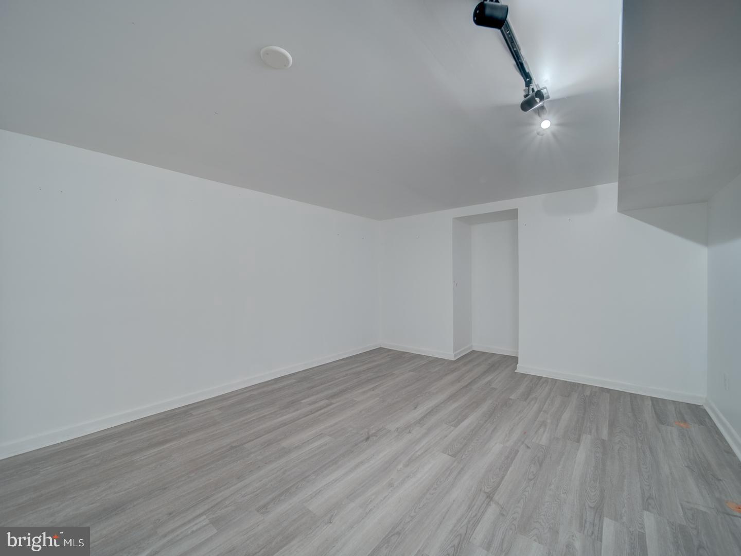 9618 Clover Hill Road Manassas, VA 20110 - Photo 57 of 61 a view of an empty room with wooden floor