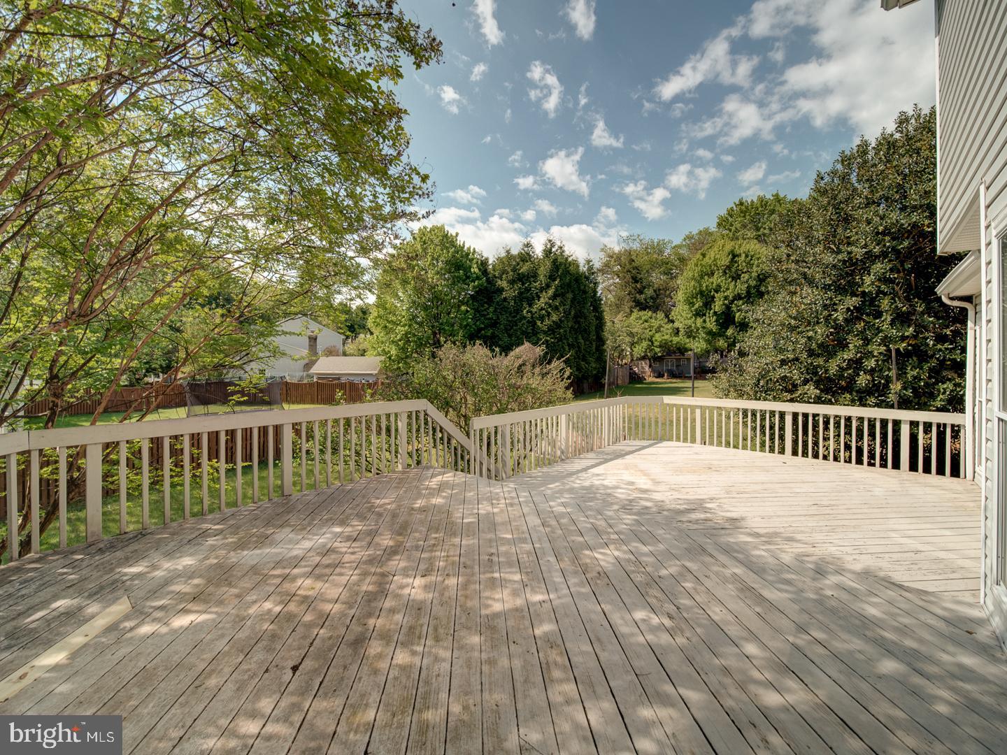 9618 Clover Hill Road Manassas, VA 20110 - Photo 8 of 61 a view of balcony with wooden floor and fence