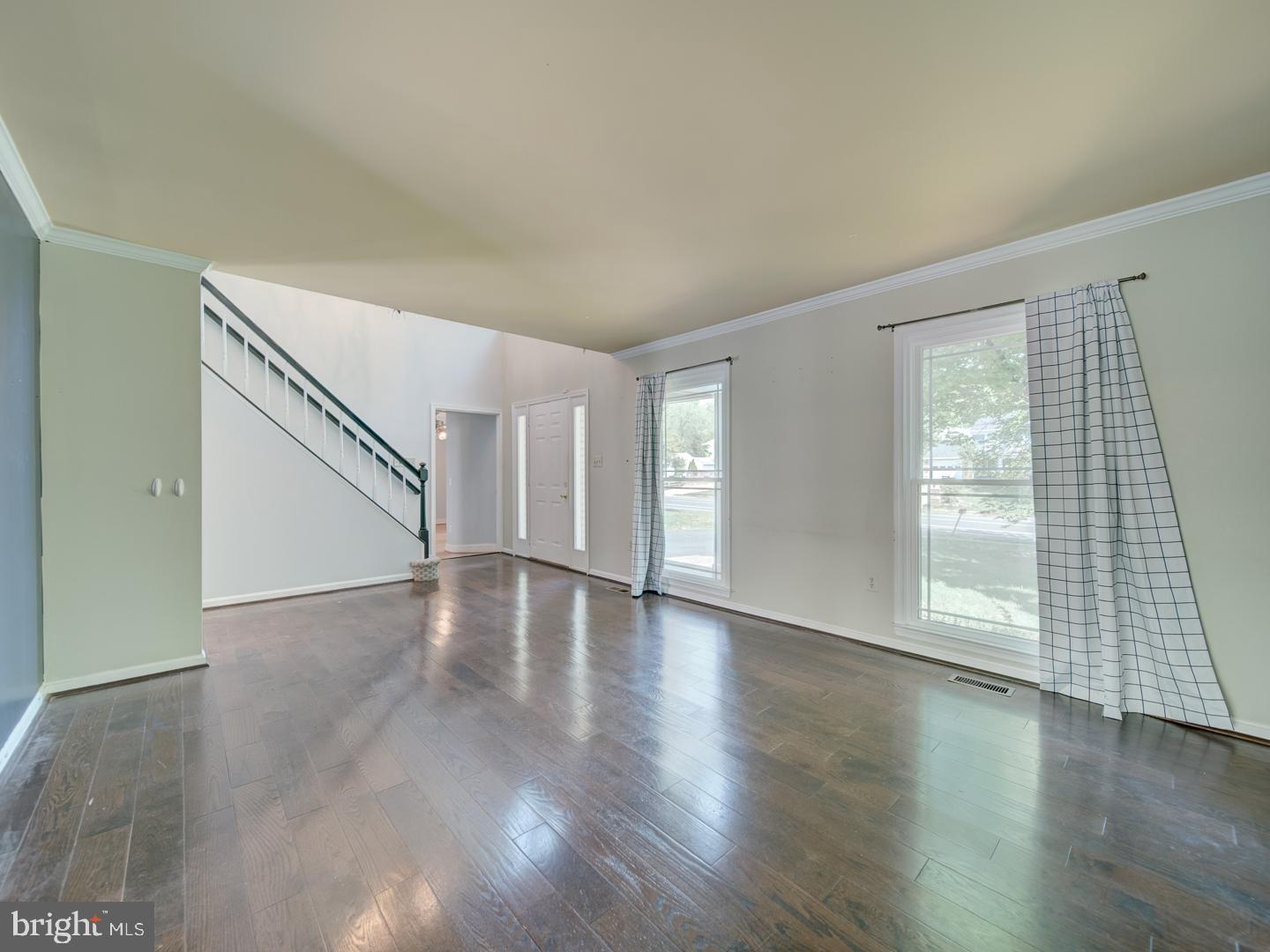 9618 Clover Hill Road Manassas, VA 20110 - Photo 10 of 61 an empty room with wooden floor and windows