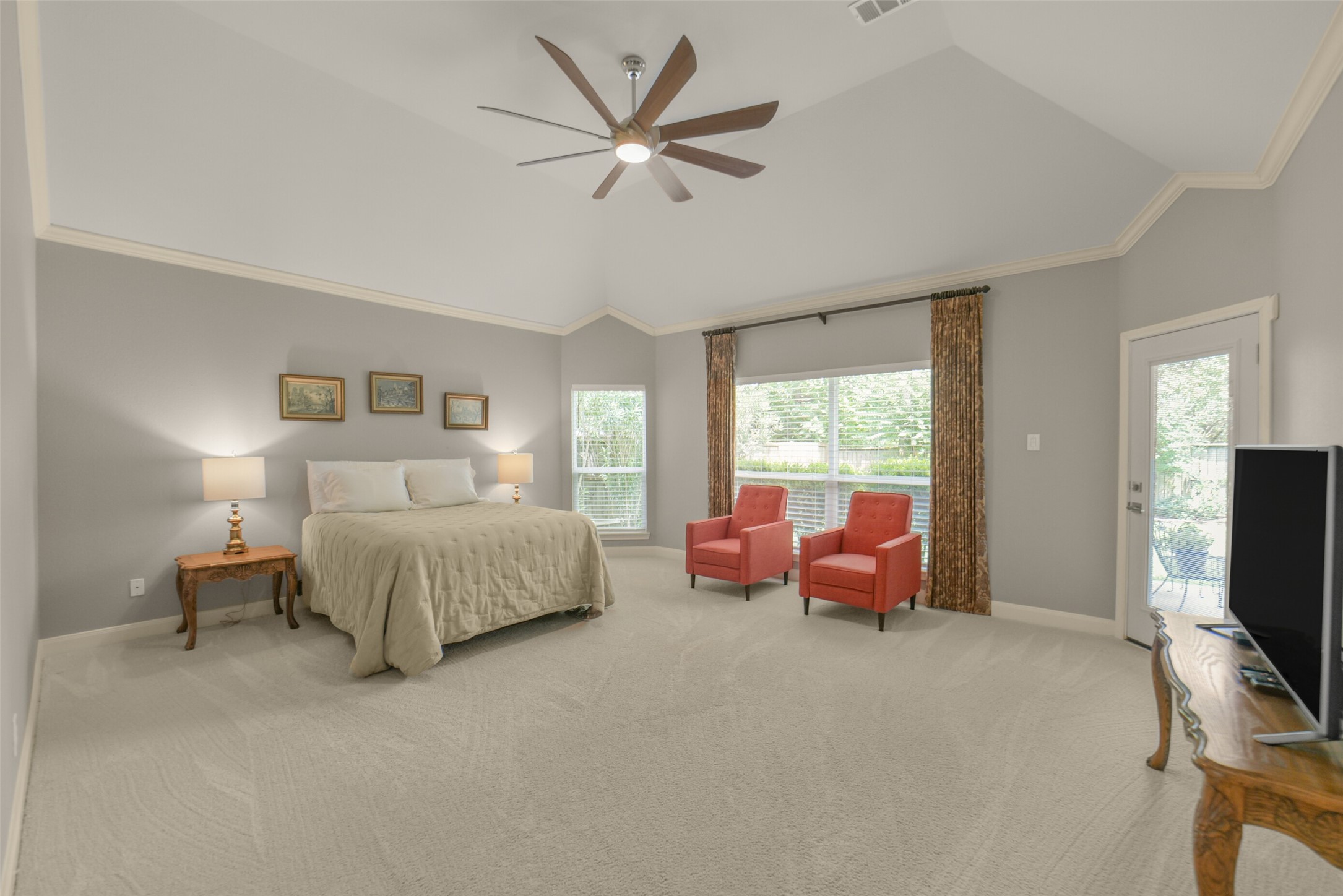 1310 Lambourne Circle Spring, TX 77379 - Photo 25 of 50 Spacious main bedroom with convenient door leading to the back patio