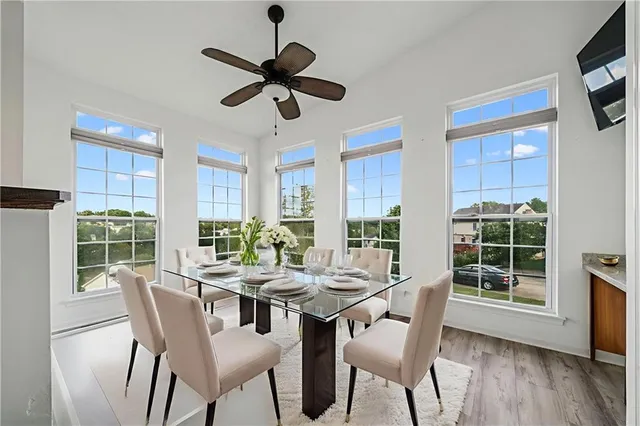 a living room with furniture and a painting on the wall