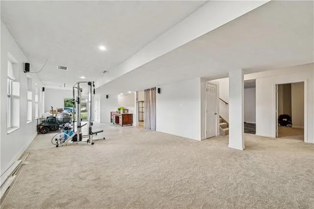 a view of a livingroom with furniture and a flat screen tv