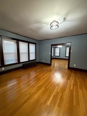 466 Locust Street, Unit 2 Fall River, MA 02720 - Photo 3 of 10 a view of empty room with wooden floor