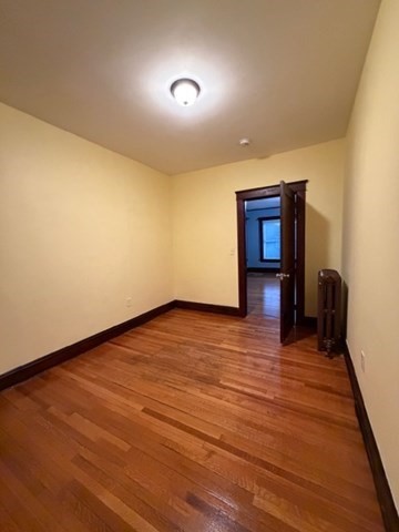 466 Locust Street, Unit 2 Fall River, MA 02720 - Photo 5 of 10 a view of empty room with wooden floor