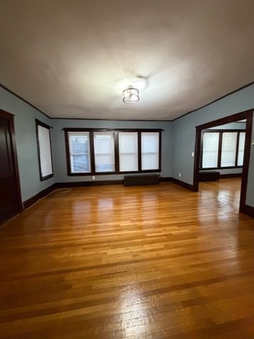466 Locust Street, Unit 2 Fall River, MA 02720 - Photo 6 of 10 wooden floor in an empty room with a window
