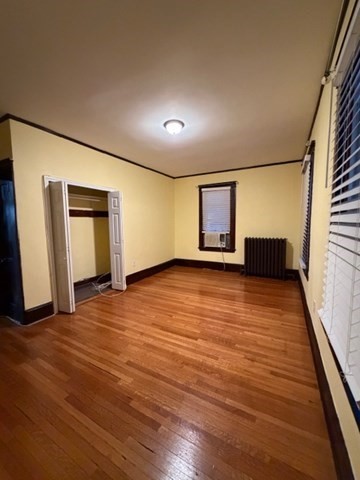 466 Locust Street, Unit 2 Fall River, MA 02720 - Photo 7 of 10 a view of empty room with wooden floor