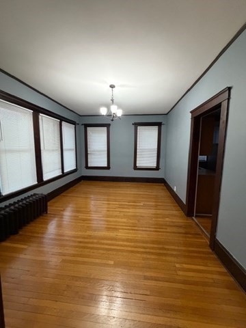 466 Locust Street, Unit 2 Fall River, MA 02720 - Photo 9 of 10 wooden floor in an empty room with a window