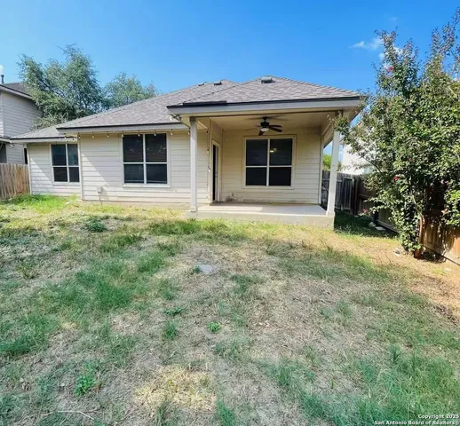 a view of a house with yard and plants