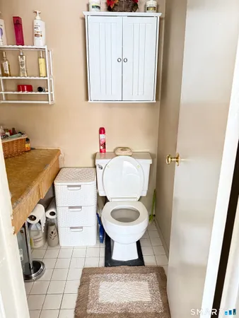 a bathroom with a sink toilet and a mirror