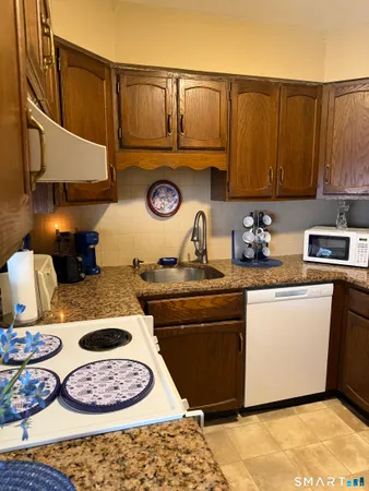 a kitchen with a stove and a refrigerator