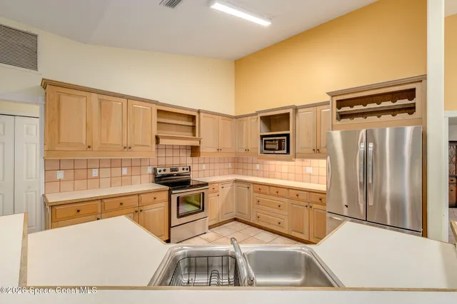 a room with window and shelf