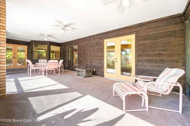 a view of a swimming pool with a patio