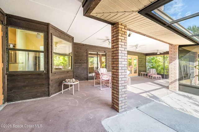 a view of a swimming pool with palm trees