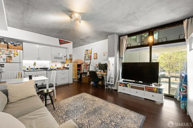 a living room with furniture and a flat screen tv