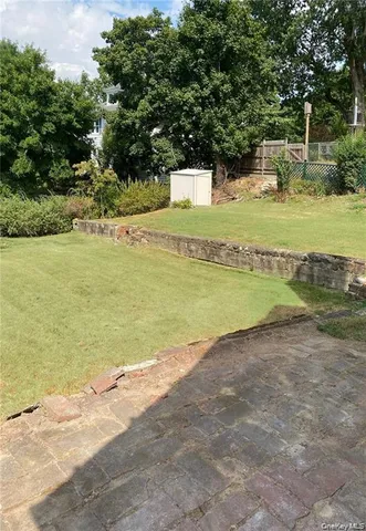 a view of a swimming pool with a yard