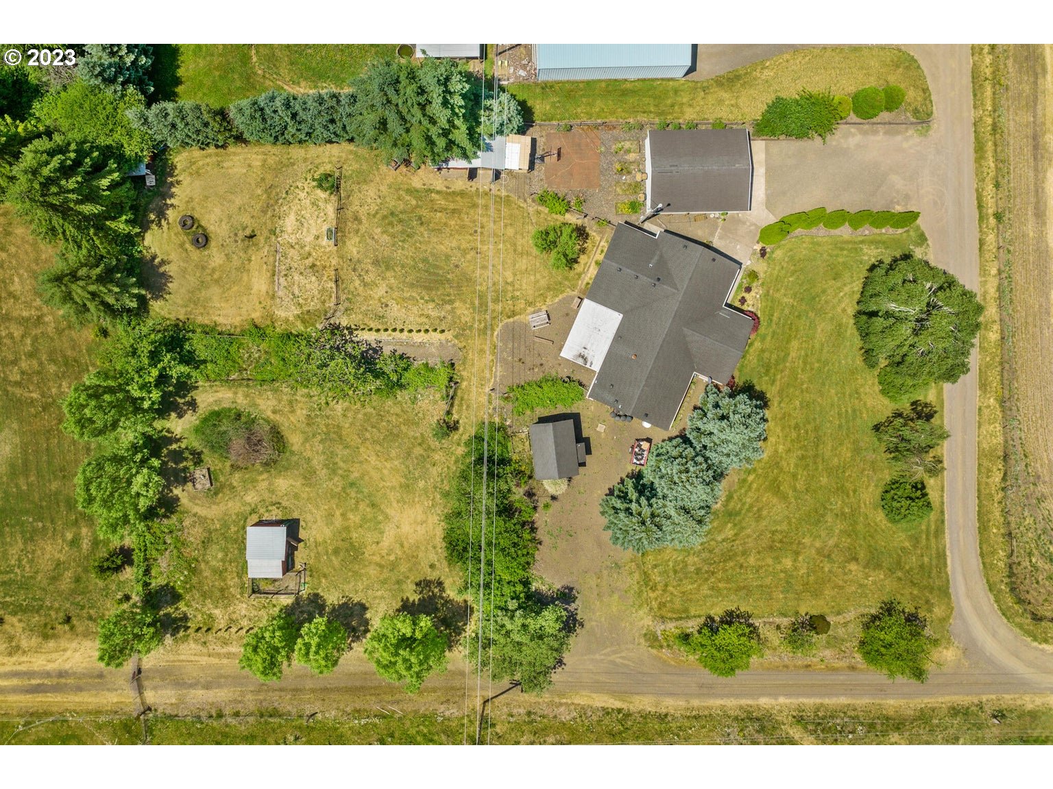 7546 South Prairie Road Tillamook, OR 97141 - Photo 2 of 36 an aerial view of a house with a yard