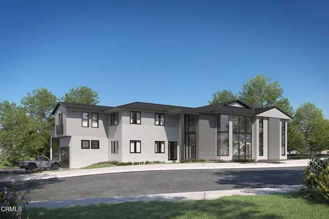 front view of a house with a yard