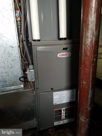 a view of a blue house with a yard