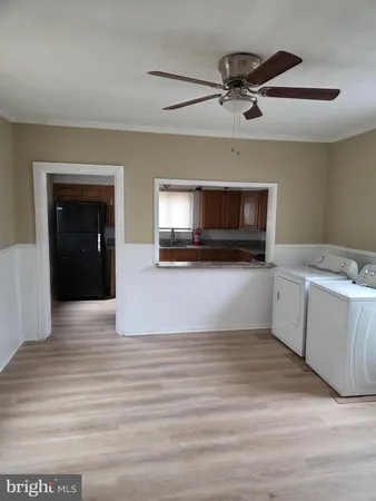 a view of a kitchen with microwave and cabinets