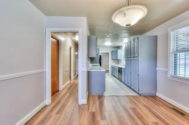 a view of a kitchen cabinets and wooden floor