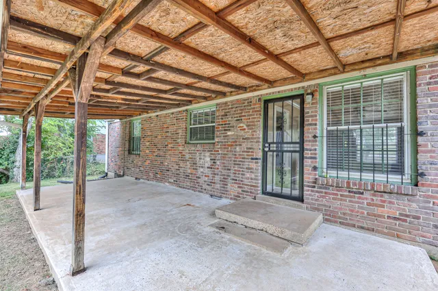 a view of a porch with a backyard
