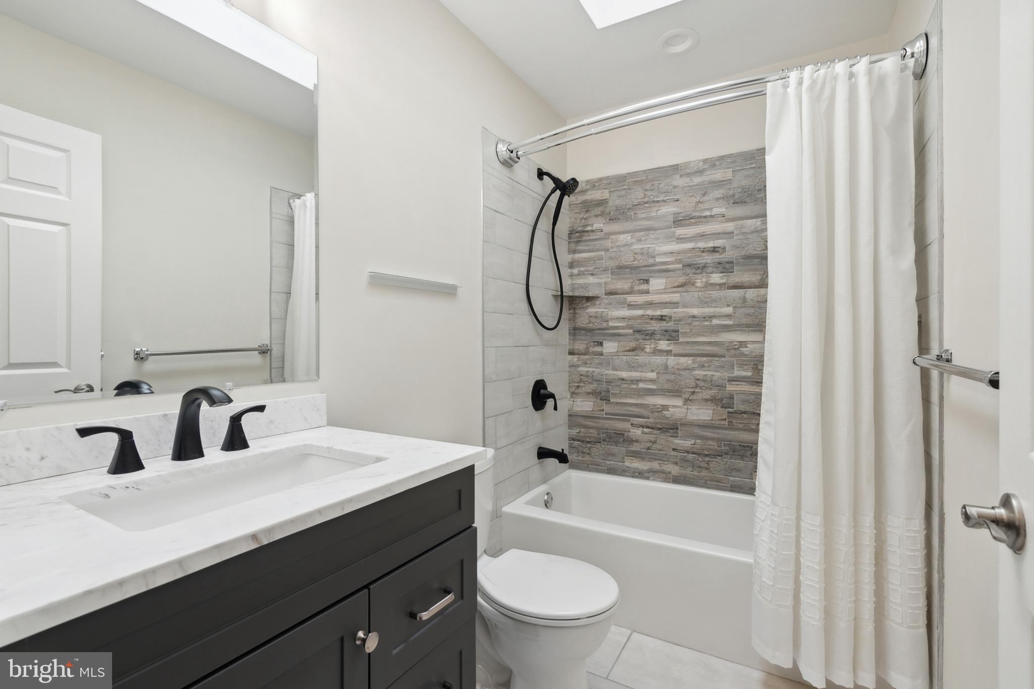 45 Country Club Road Pine Hill, NJ 08021 - Photo 18 of 25 a bathroom with a sink a toilet and shower