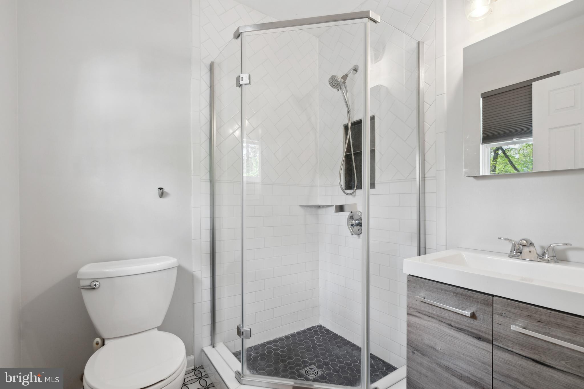 45 Country Club Road Pine Hill, NJ 08021 - Photo 21 of 25 a bathroom with a toilet a sink and shower