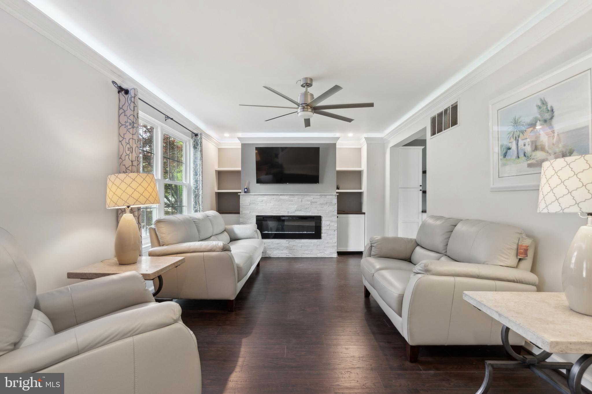 45 Country Club Road Pine Hill, NJ 08021 - Photo 3 of 25 a living room with furniture a fireplace and a flat screen tv