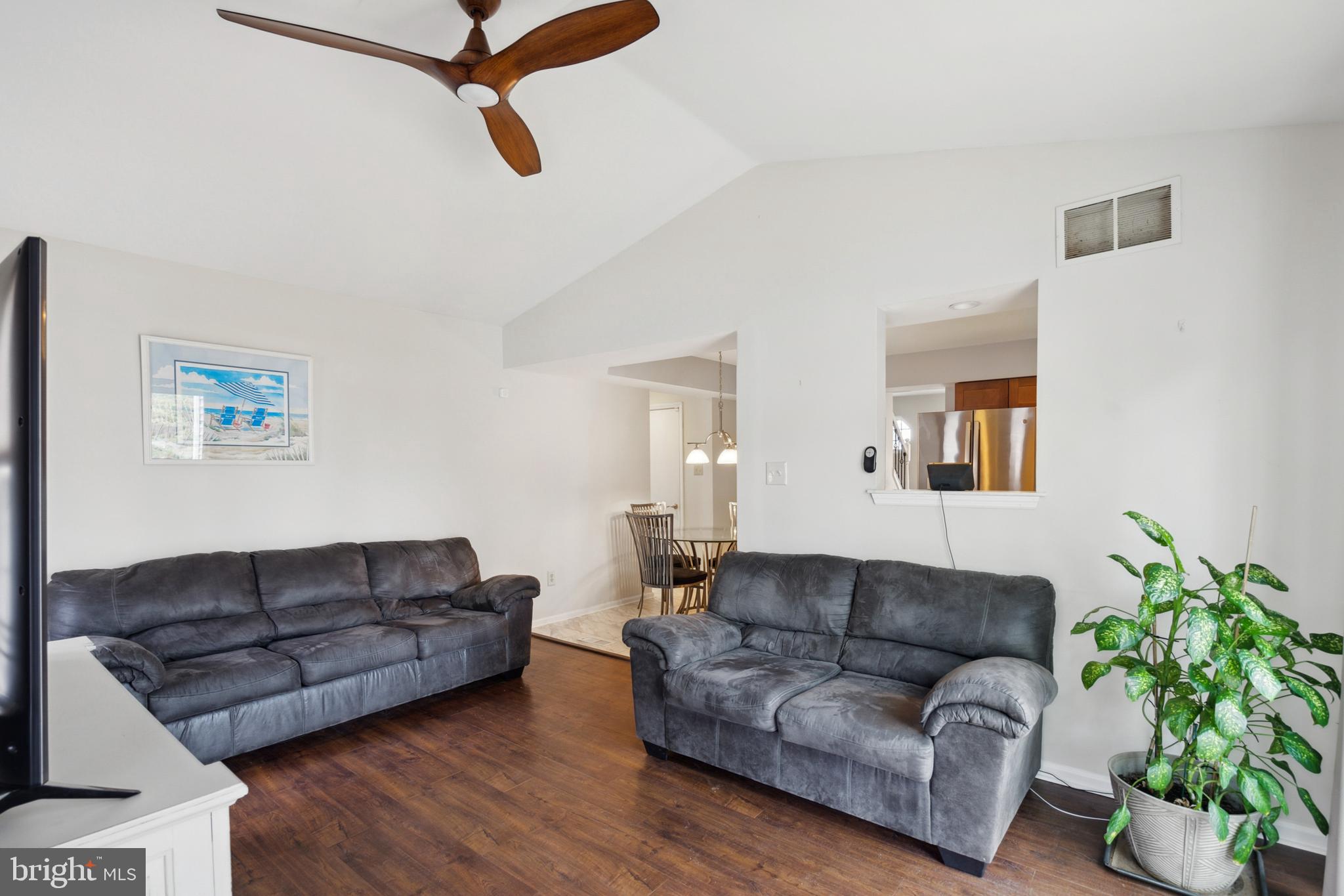 45 Country Club Road Pine Hill, NJ 08021 - Photo 10 of 25 a living room with furniture a couch and a potted plant