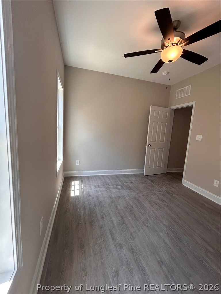 307 Elizabeth Street Spring Lake, NC 28390 - Photo 4 of 12 a view of an empty room with a ceiling fan and window