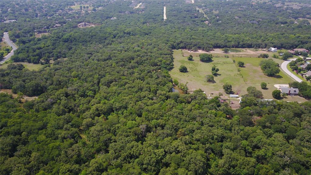 3400 Foxfire Lane Grapevine, TX 76092 - Photo 1 of 16 a view of a garden with a building
