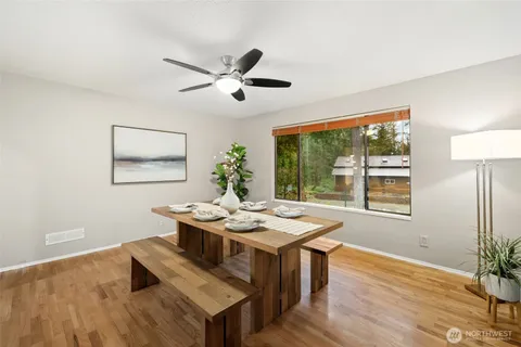 a view of a livingroom with furniture window and wooden floor