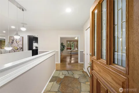 a view of a living room and a balcony