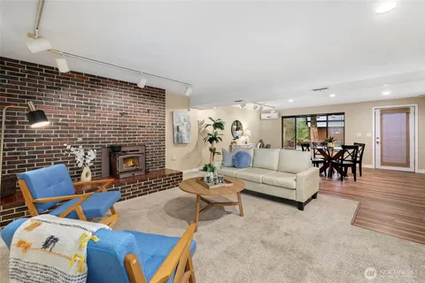 a living room with furniture fireplace and a fireplace