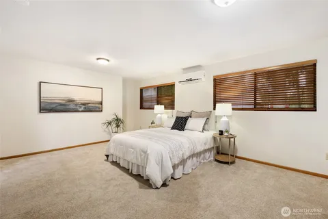 a bathroom with a granite countertop sink toilet a mirror a vanity and shower