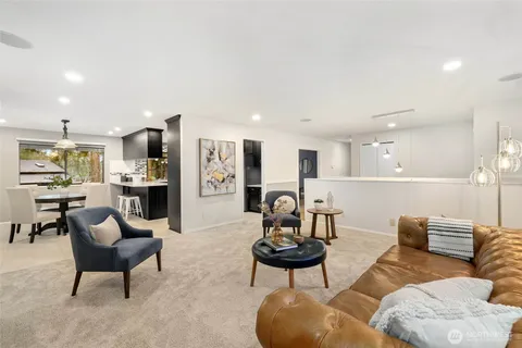 a living room with furniture kitchen and a kitchen view