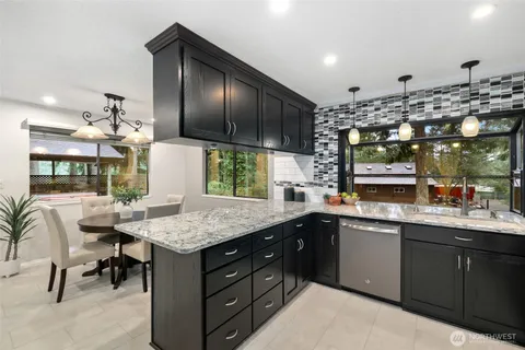 a kitchen with a sink stove and cabinets