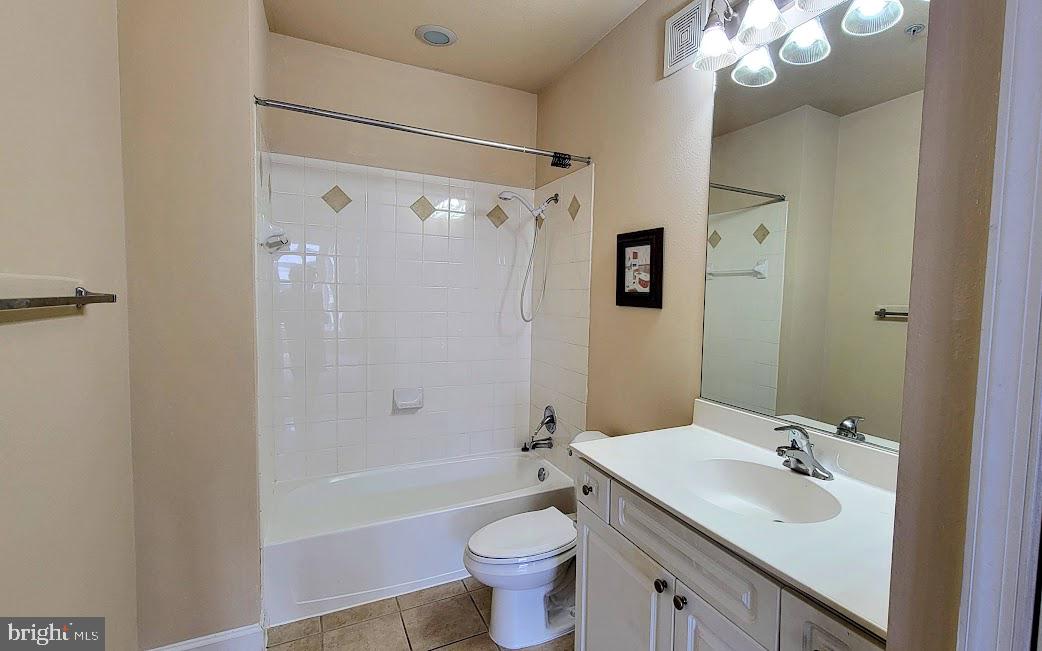 501 Hungerford Drive, Unit 207 Rockville, MD 20850 - Photo 12 of 23 a bathroom with a sink a toilet and shower