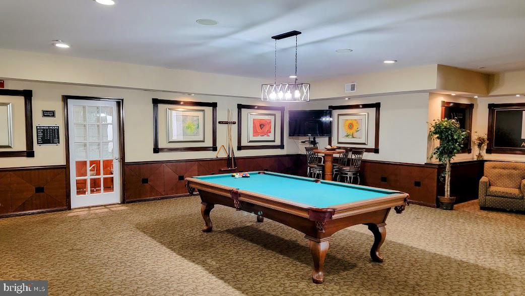 501 Hungerford Drive, Unit 207 Rockville, MD 20850 - Photo 15 of 23 a room with pool table and windows