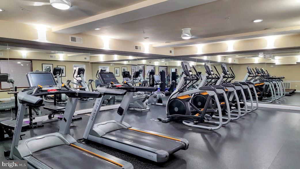 501 Hungerford Drive, Unit 207 Rockville, MD 20850 - Photo 20 of 23 a view of a room with gym equipment