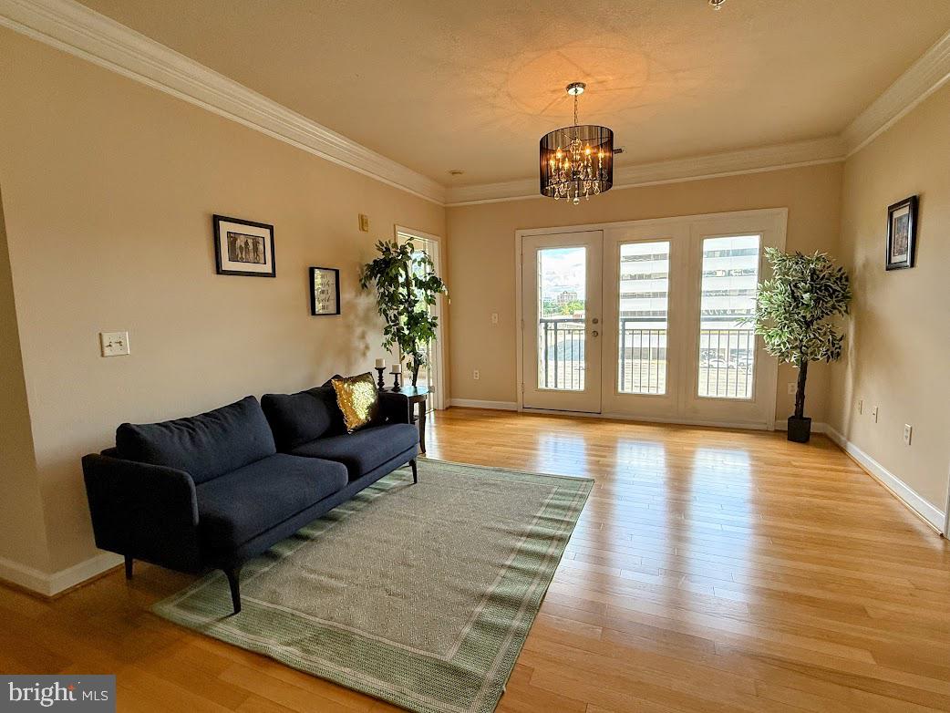 501 Hungerford Drive, Unit 207 Rockville, MD 20850 - Photo 2 of 23 a living room with furniture and a window